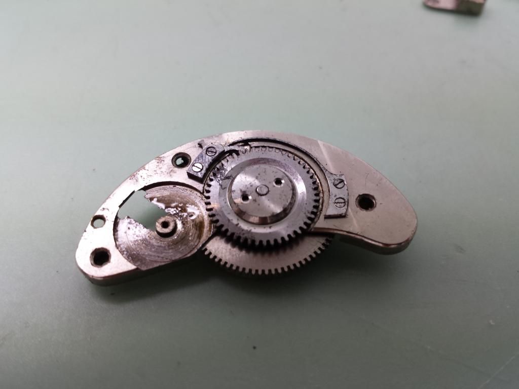 How do you remove the mainspring barrel from this bridge ? WatchUSeek