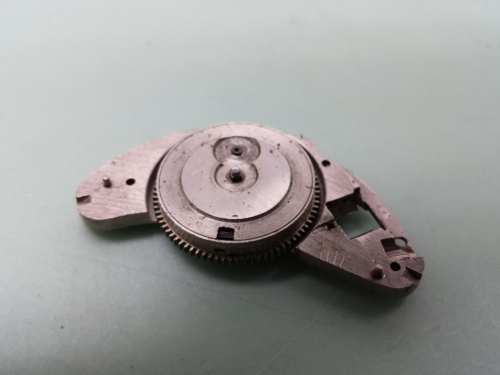 How do you remove the mainspring barrel from this bridge ? WatchUSeek